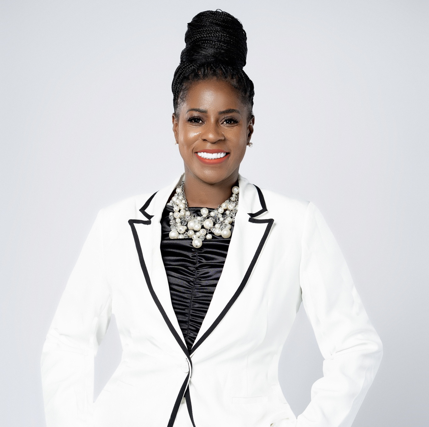 Racynta Abdullah in white blazer
